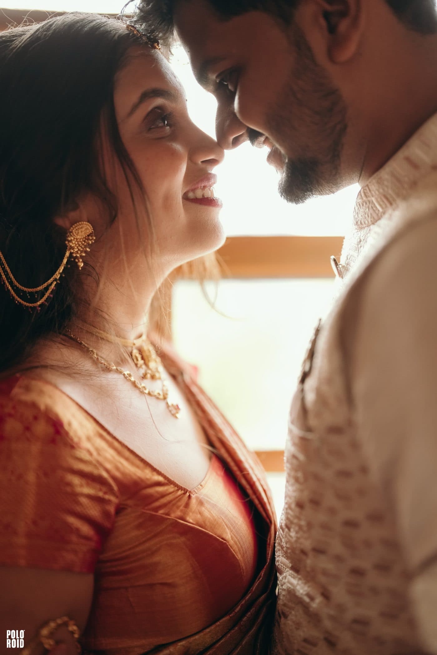 Sneha and Sudhanva, foreheads touching, smiling